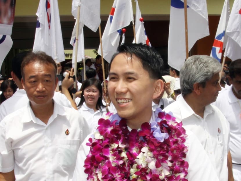 Mr Alex Yam (centre), seen here during the run up to GE 2011, was one of the PAP MPs who expressed surprise at the electoral boundary report. TODAY file photo