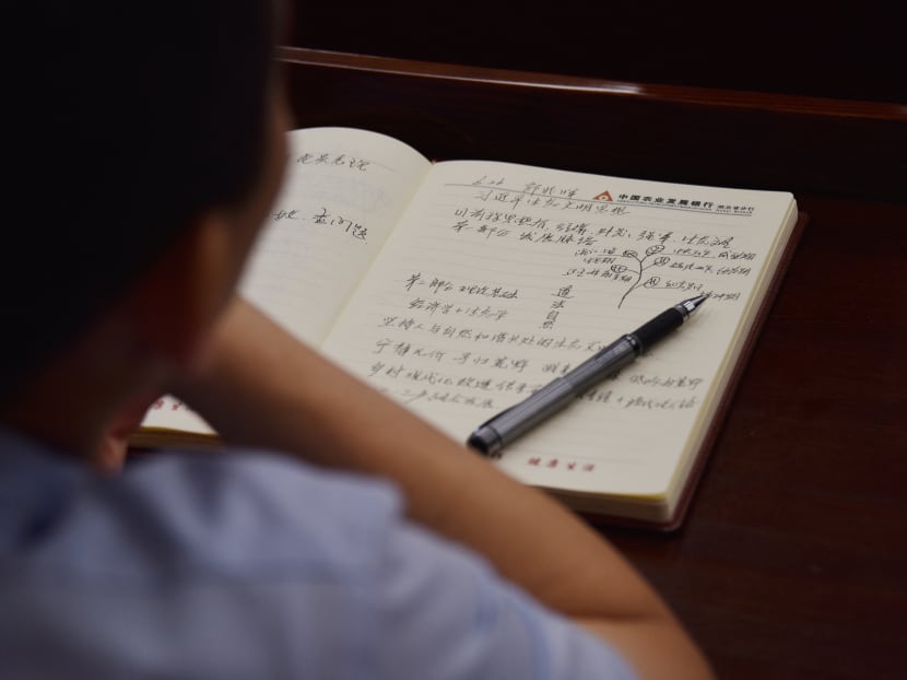 An adult student taking notes on Xi Jinping thought in a class at the Party School of the Chinese Communist Party's Central Committee, during a government-organised tour for foreign journalists in Beijing on June 26, 2019.