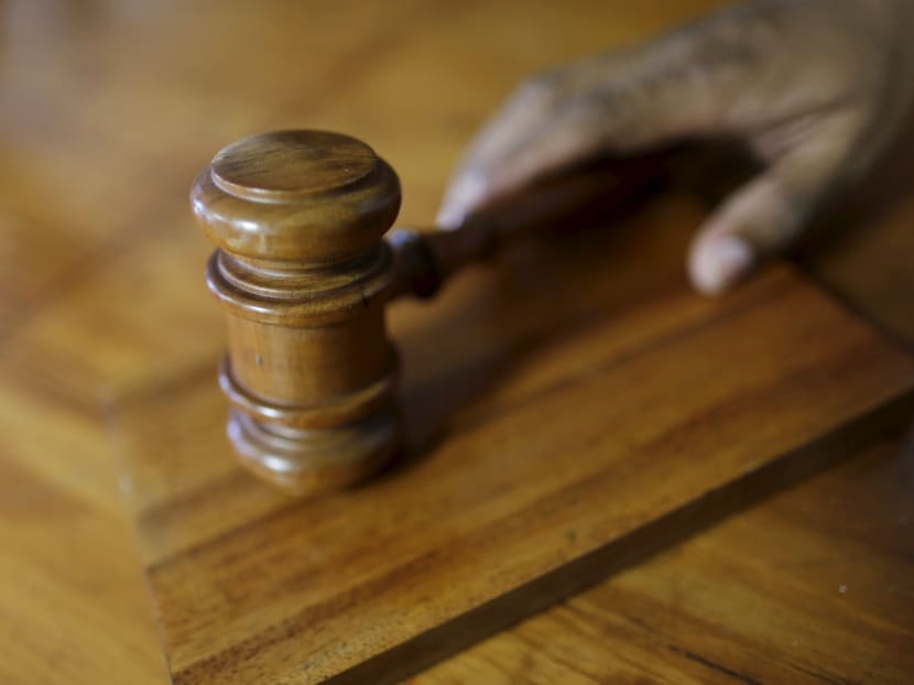 A district judge chastised a businessman who molested a private nurse he had hired to look after his cancer-stricken wife as he imposed a sentence of seven months’ jail and three strokes of caning on Friday (Oct 13). Photo: Reuters