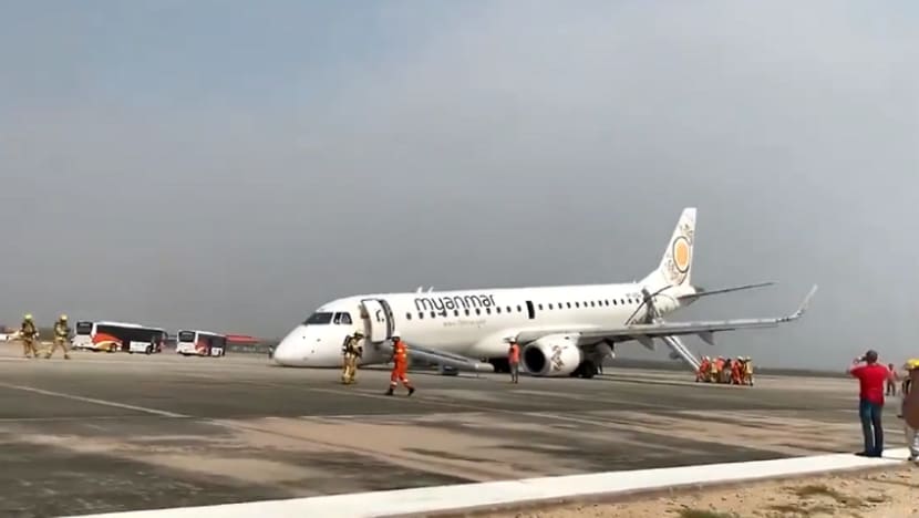 Myanmar plane in emergency touchdown as landing gear fails Myanmar plane in emergency touchdown as landing gear fails