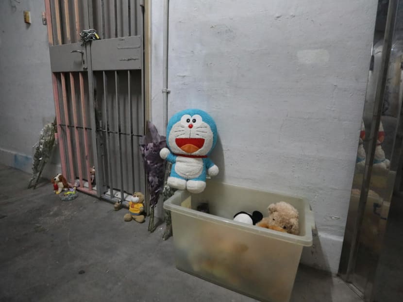 Toys and sweets outside the flat in Chin Swee Road where the toddler's remains were found in September, 2019.