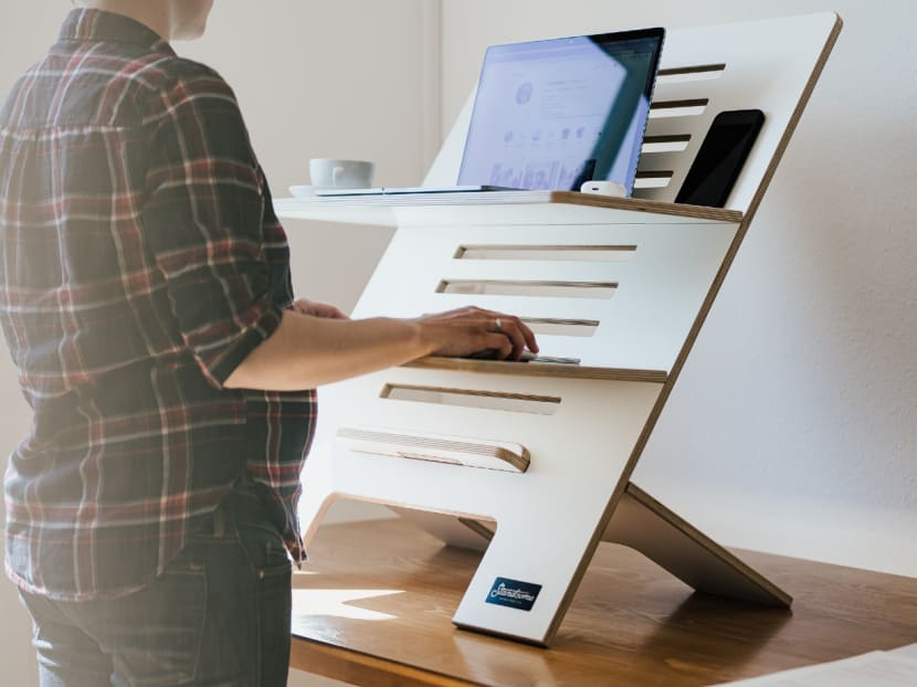 A woman at a standing workstation. Employers are encouraged to build on the work-from-home arrangement prevalent during the Covid-19 pandemic and introduce other types of flexible work plans to cater to the different needs of employees. A woman at a standing workstation. Employers are encouraged to build on the work-from-home arrangement prevalent during the Covid-19 pandemic and introduce other types of flexible work plans to cater to the different needs of employees.