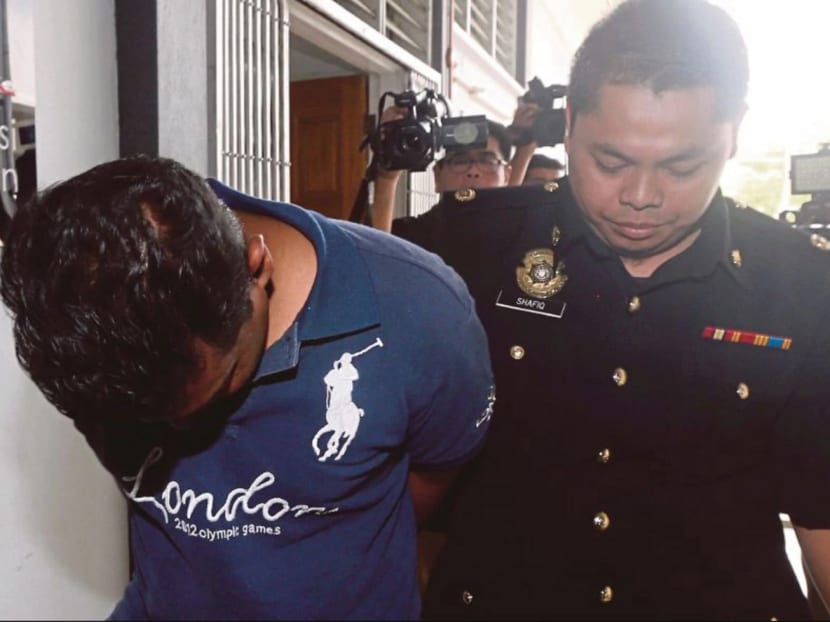 A former inspector being brought to court in Kota Bharu, Kelantan on May 18. After the recent arrests of policemen by the MACC, police sources said they received WhatsApp messages asking them to stop entertaining demands from their superiors. Photo: NST
