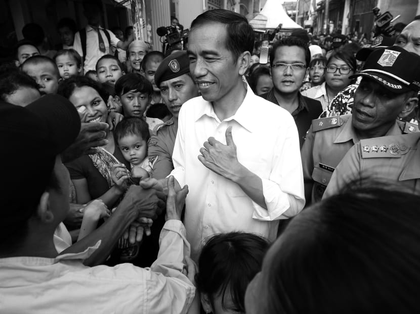 Famous for his ‘blusukan’ or unplanned visits, Jakarta’s Governor Joko Widodo immerses himself well at the grassroots and village levels. PHOTO: REUTERS