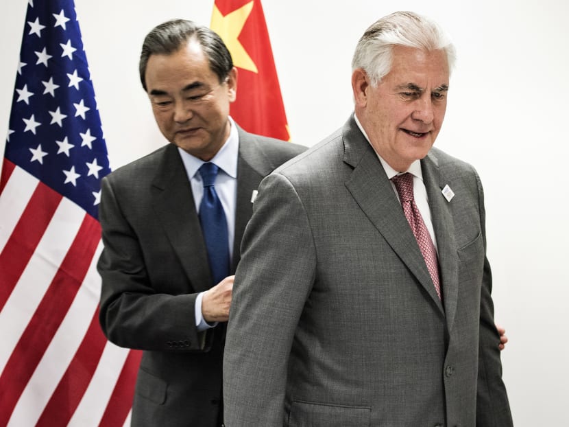 US Secretary of State Rex Tillerson (R) and China's Foreign Minister Wang Yi walk to their seats before a meeting on the sidelines of a gathering of Foreign Ministers of the G20 leading and developing economies at the World Conference Center in Bonn, western Germany, on Feb 17, 2017. Photo: AFP