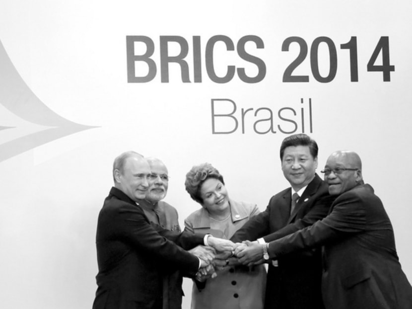 Leaders of the Brazil,Russia, India, China and South Africa at a summit earlier this year. China has launched projects to give it a bigger role in global trade and finance, including the establishment of the New Development Bank with the BRICS nations. Photo: Reuters