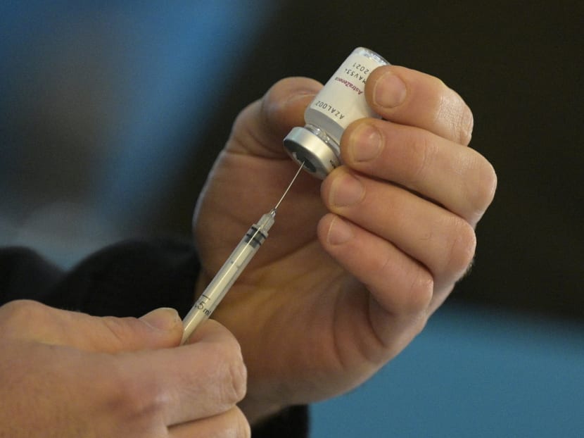 A member of the Armed Forces prepares a dose to vaccinate colleagues with the AstraZeneca/Oxford Covid-19 vaccine obtained through the Covax scheme at the CCK Cultural Centre in Buenos Aires on June 15, 2021.