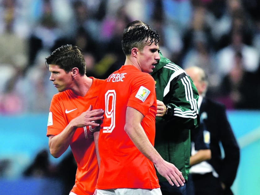 Van Gaal sent on Huntelaar (left) in place of the tiring Van Persie, thereby using the last of his substitutions. PHOTO: AP
