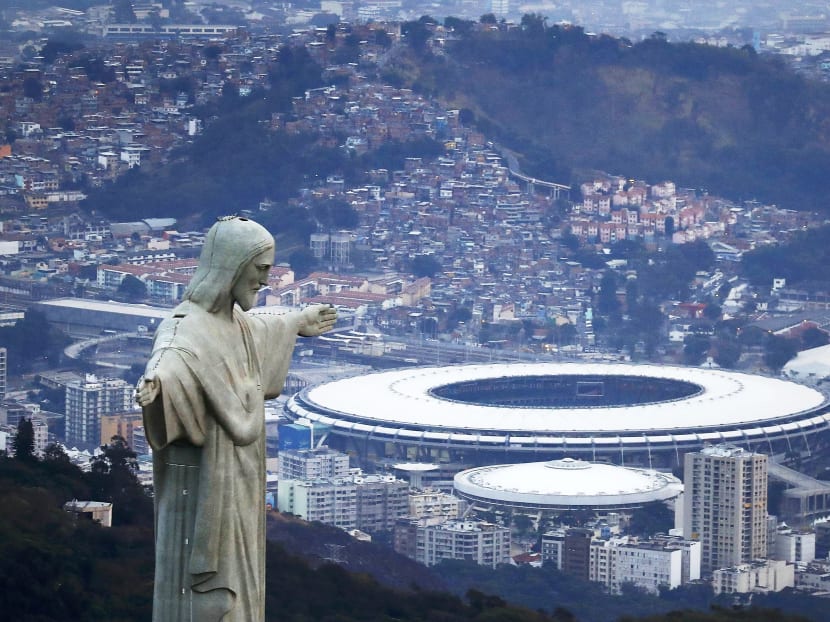 Jesus Christ the Redeemer, near Maracana Stadium, during sunrise in Rio de Janeiro. The city is struggling under a difficult economic and political climate and the ongoing Zika threat. Photo: Reuters