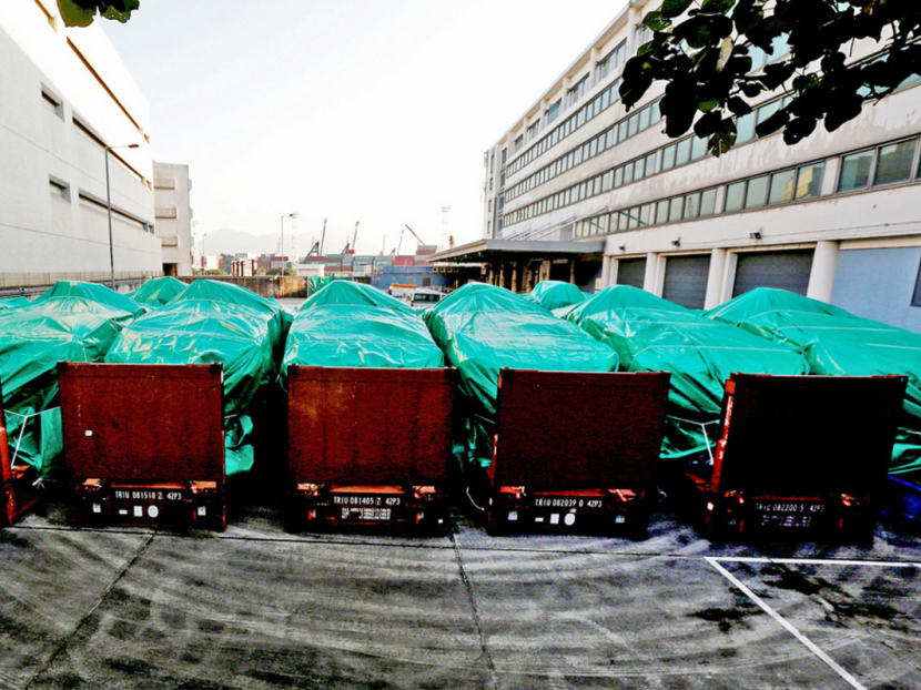 Armoured troop carriers belonging to Singapore were held at a cargo terminal in Hong Kong last November. Six MPs have tabled questions on the situation, hoping to discuss on Monday the process of getting the vehicles back. Photo: Reuters