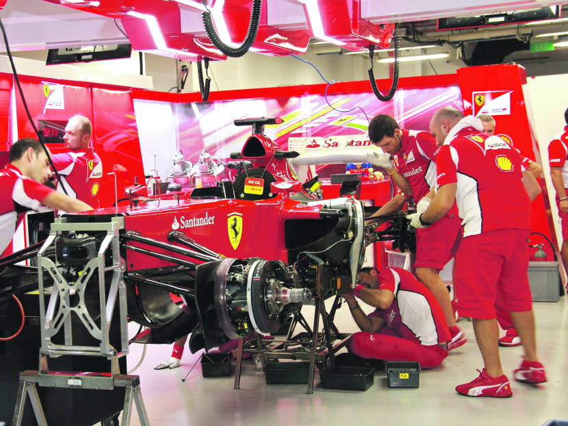 Ferrari engineers working on the car during last year’s Singapore Grand Prix. Top engineers from the F1 teams will drop by tertiary institutions here to inspire budding minds with insights on how they build the fastest racing machines on earth. TODAY file photo