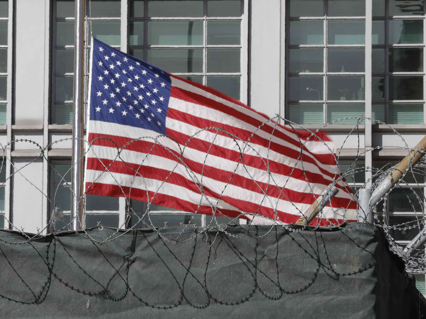 A flag flies behind an enclosure on the territory of the US embassy in Moscow, Russia. Photo: Reuters