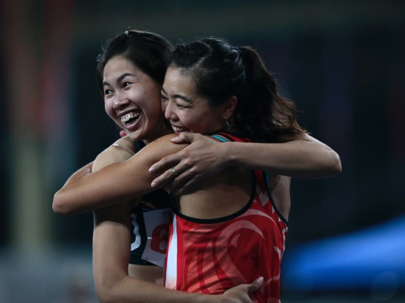 Michelle Sng hugs Vietnam's Duong Thi Viet Anh after they competed in the SEA Games womens high jump on August 24, 2017. Photo: Jason Quah/TODAY