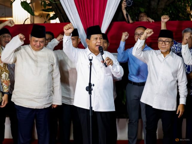 Indonesia's front-runner presidential candidate and Defence Minister Prabowo Subianto, along with his coalition members, gesture as he delivers his speech after the country's election commission announced last month's presidential election result, in Jakarta, Indonesia, on March 20, 2024. 