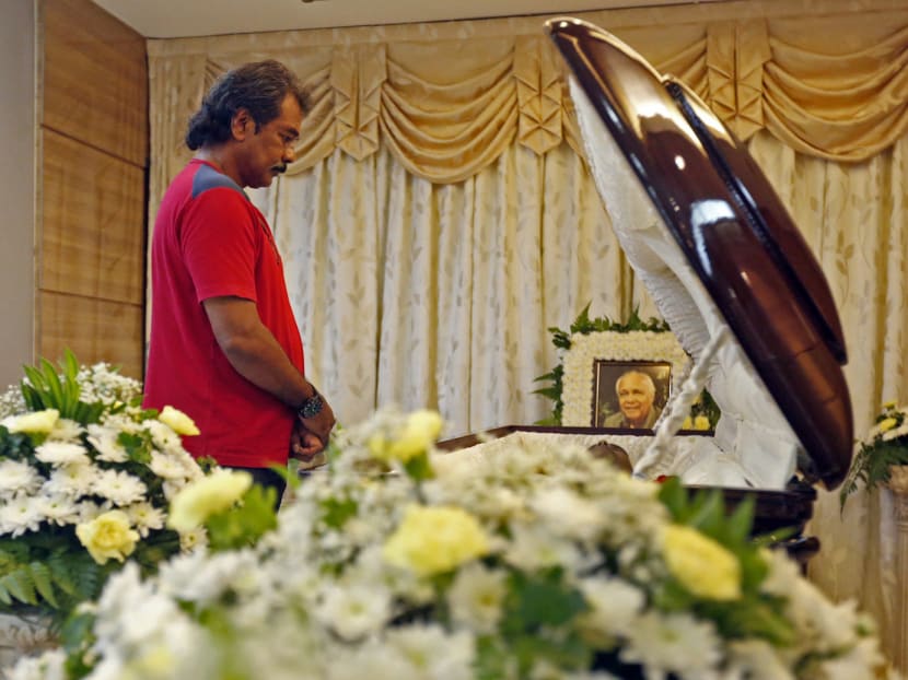 Ex-national captain Terry Pathmanathan paying his last respects to the late N Ganesan. Photo: Ernest Chua
