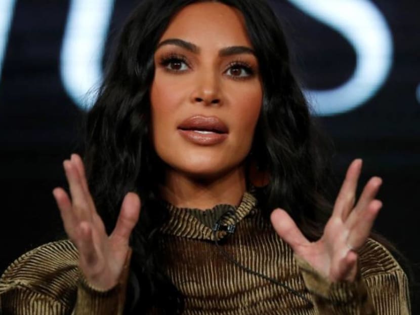 How is Kim Kardashian greeting other people now that she can’t shake hands?