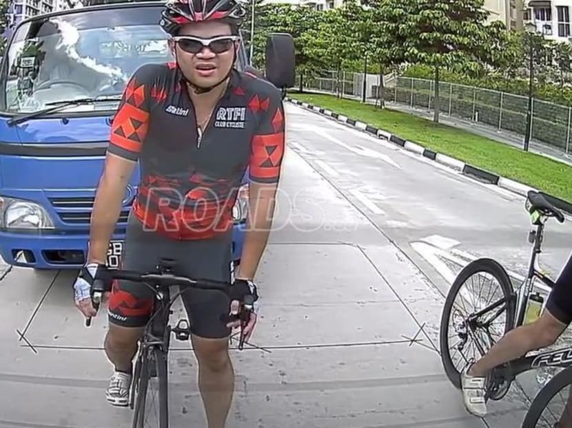 A screengrab of a viral video showing cyclist Eric Cheung Hoyu just before the incident in which lorry driver Teo Seng Tiong, in the blue lorry behind him, was found to have deliberately swerved to hit him.