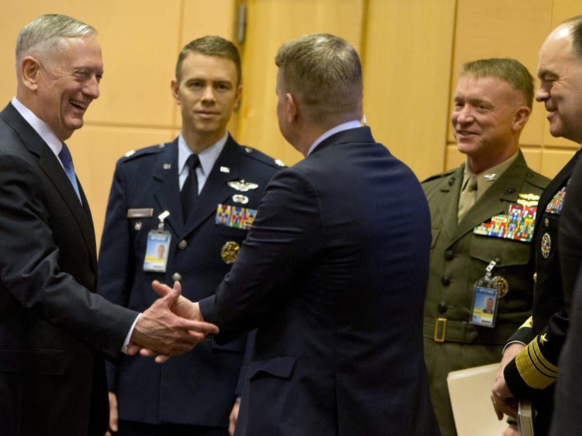 US Secretary of Defence Jim Mattis (left) speaking with members of his delegation prior to a meeting at NATO headquarters in Brussels on Feb 15, 2017. Photo: AP
