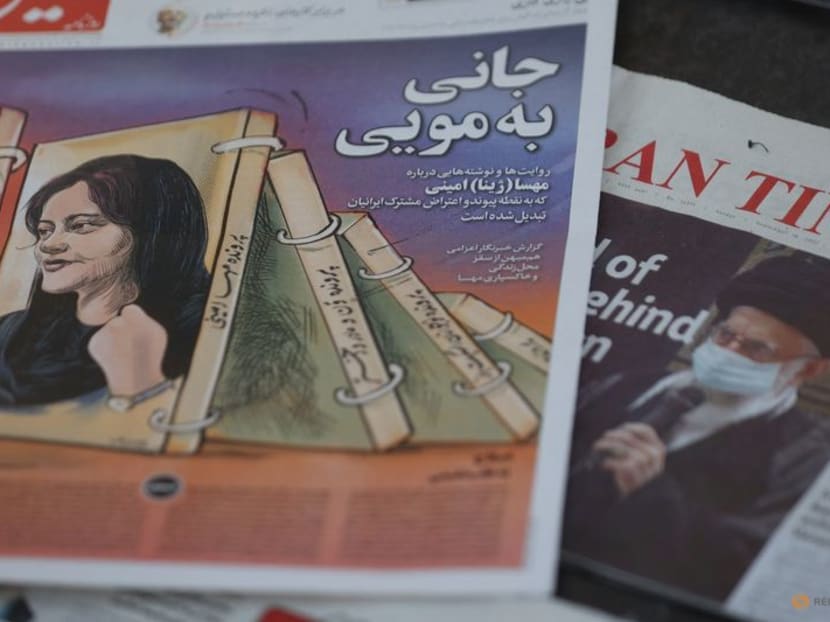 FILE PHOTO: A newspaper with a cover picture of Mahsa Amini, a woman who died after being arrested by the Islamic republic's "morality police" is seen in Tehran, Iran September 18, 2022. Majid Asgaripour/WANA (West Asia News Agency) via REUTERS 