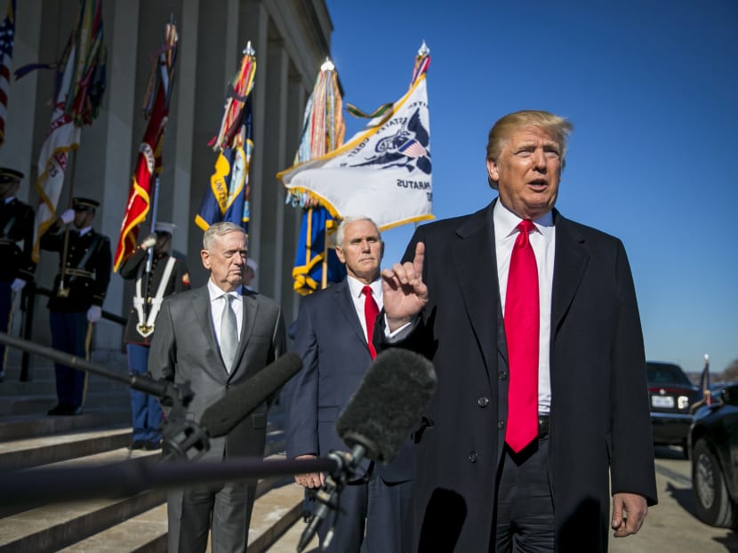 US President Donald Trump speaks to reporters as he arrives with Defence Secretary James Mattis and Vice President Mike Pence at the Pentagon. A new nuclear policy issued by the Trump administration is touching off a new kind of nuclear arms race. Photo: The New York Times