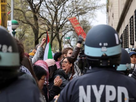 Law enforcement officers stand guard as demonstrators protest in solidarity with Pro-Palestinian organizers on the Columbia University campus, amid the ongoing conflict between Israel and the Palestinian Islamist group Hamas, in New York City, US, on April 18, 2024. 