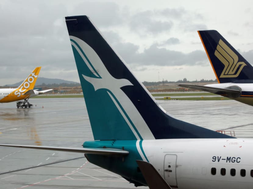 SilkAir, Singapore Airlines and Scoot planes sit on the tarmac at Changi Airport in Singapore on October 4, 2017.