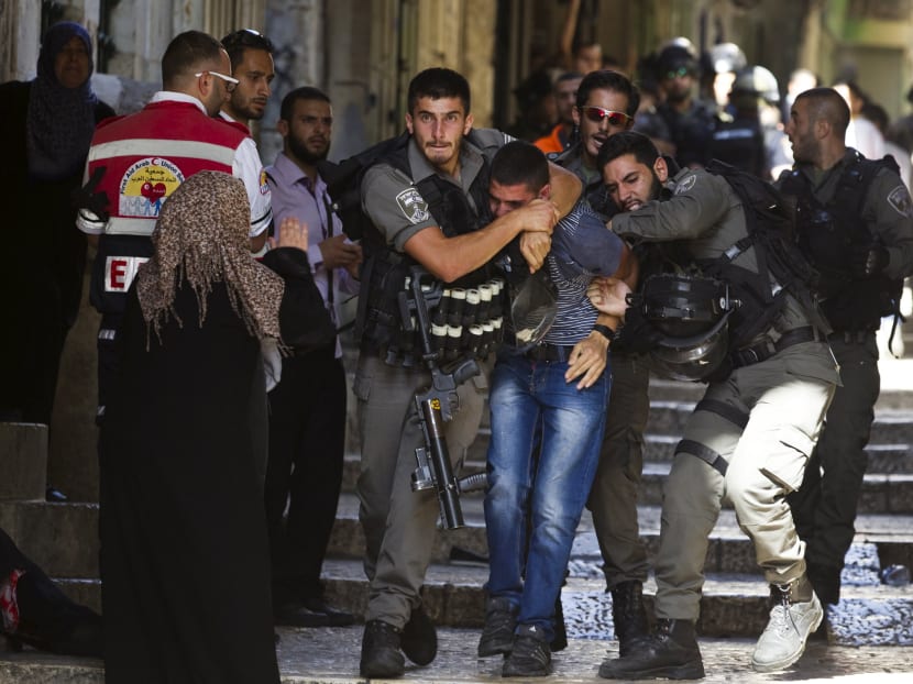 Gallery: Israeli police enter Jerusalem holy site, block Arab youths