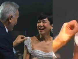 Zhu Houren calls himself a 'mountain tortoise' for pulling up the strap of Kym Ng's off-shoulder gown at Star Awards