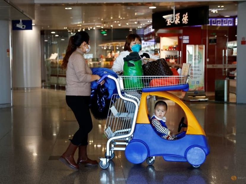 Travellers wait for their flight at Beijing Capital International Airport, amid the coronavirus disease (COVID-19) outbreak in Beijing, China December 27, 2022. REUTERS/Tingshu Wang