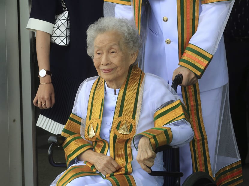 91 year-old Ms Kimlun Jinakul sits on cart graduate from Sukhothai Thammathirat Open University before receiving her bachelor’s degree from Thailand's King Maha Vajiralongkorn Bodindradebayavarangkun. Photo: AP
