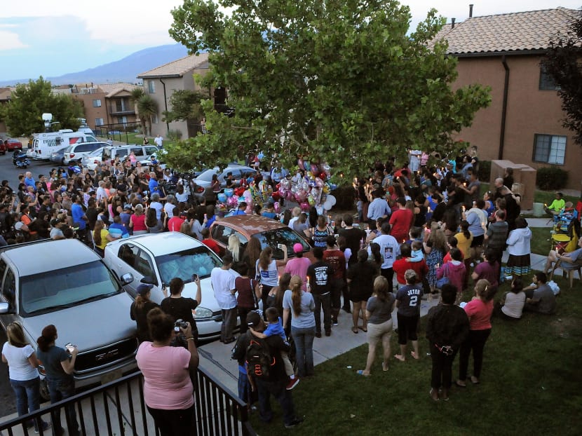In this Aug 25, 2016 file photo, a couple hundred people attend a candlelight vigil for 10-year-old Victoria Martens at the apartment complex in Albuquerque, New Mexico, where the young girl lived and was killed. Photo: The Albuquerque Journal via AP