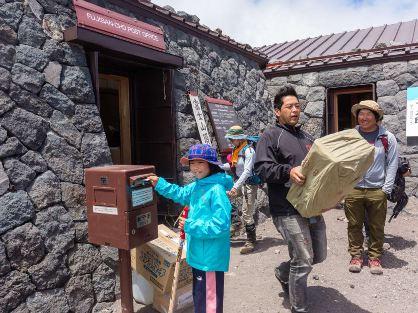 The post office on Mount Fuji was visited by close to 18,000 people last summer. They sent nearly 97,000 pieces of mail.