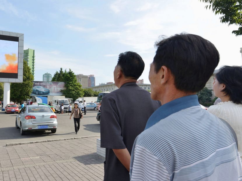 North Koreans watching a news report showing the Hwasong-12 intermediate-range ballistic missile launch, in Pyongyang on Saturday. The US is trying to find out if China and Russia are still supplying the ingredients for the rocket fuel to North Korea, or whether the North is producing it. Photo: Reuters