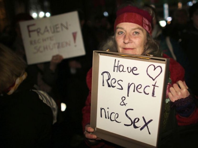 A woman at a demonstration flashes her disapproval of apparently coordinated sexual assaults against women on New Year’s Eve in Cologne. Photo: AFP
