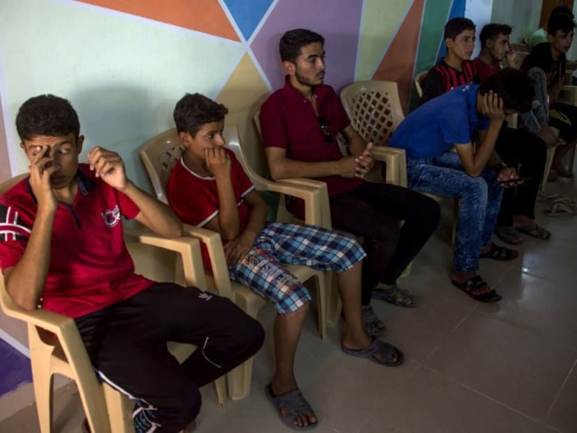 Iraqi youth, who were separated from their families during the fighting between Iraqi forces and Islamic State (IS) group jihadists around the city of Mosul, are seen at the headquarters of the Terres des Hommes Italia, a children's aid organisation, on July 16, 2017 in the Debaga region southeast of Mosul. Photo: AFP