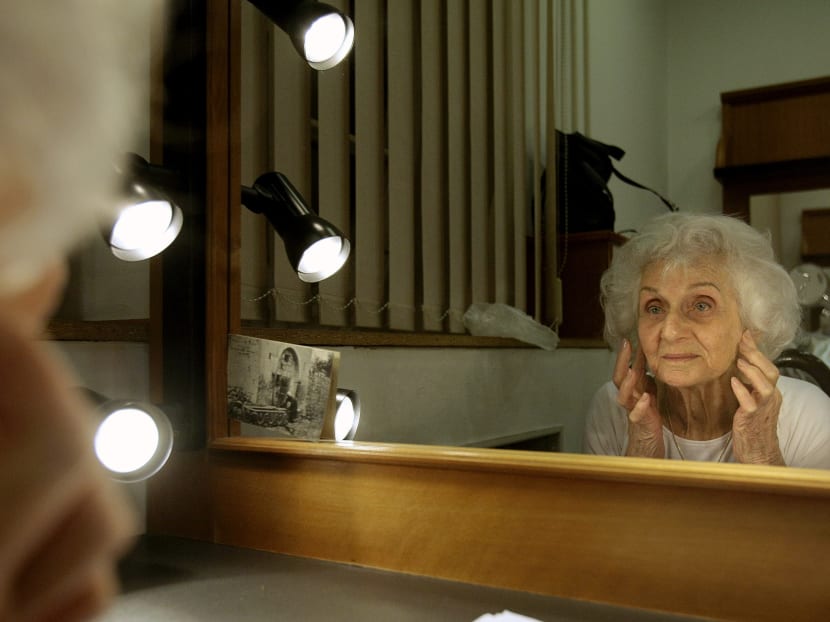 Hungarian holocaust survivor of Auschwitz-Birkenau extermination camp, Eva Fahidi, 90, prepares her make-up in her dressing room of the Vigszinhaz theater in Budapest. Photo: AFP