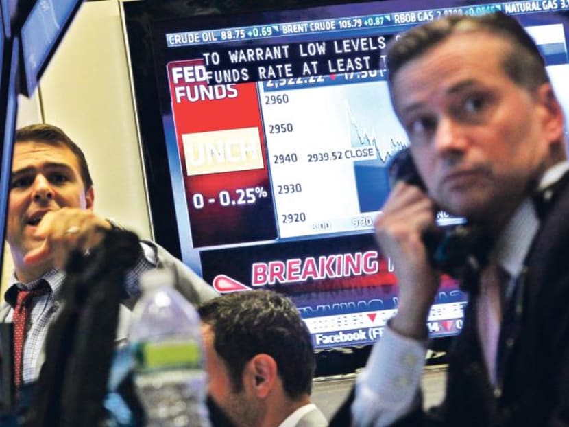 Traders on the floor of the New York Stock Exchange. US stocks had one of their most volatile five days since the financial crisis, with the Standard & Poor’s 500 Index ending last week down 6.2 per cent from the record high last month. Photo: REUTERS