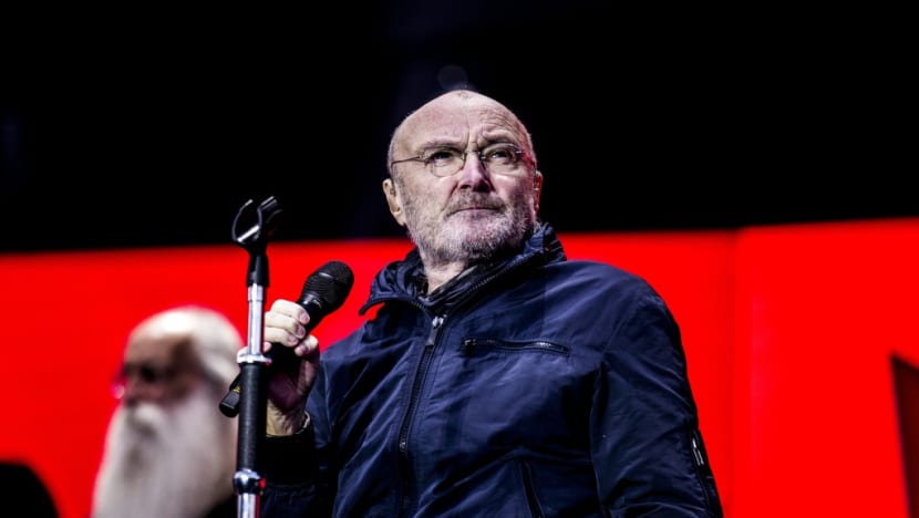 Phil Collins’ Son To Replace Him On Drums For Upcoming Genesis Reunion Tour Because He “Can Barely Hold"  A Drum Stick”