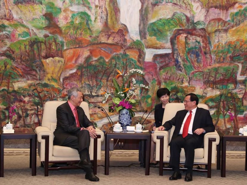 Prime Minister Lee Hsien Loong meets Shanghai party chief Li Qiang (right) on Wednesday (April 11).