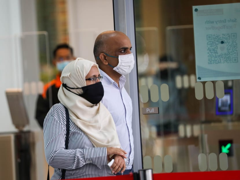 Syed Mohamed Peeran Syed Ameer Hamza and his wife Sabah Parveen outside the State Courts in June 2021.