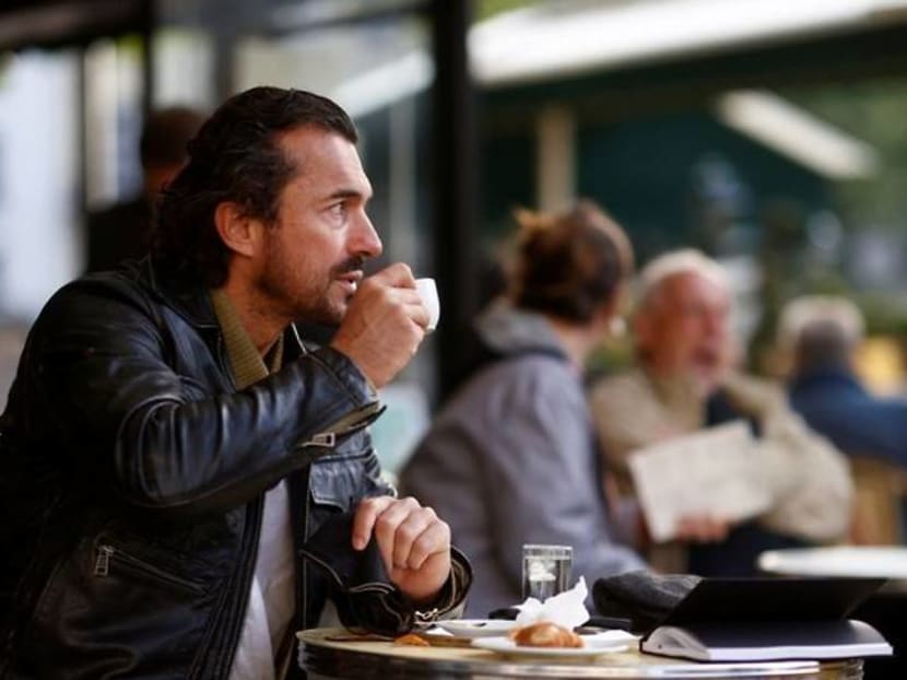 Parisians tuck into coffee and croissants again as cafes re-open Parisians tuck into coffee and croissants again as cafes re-open