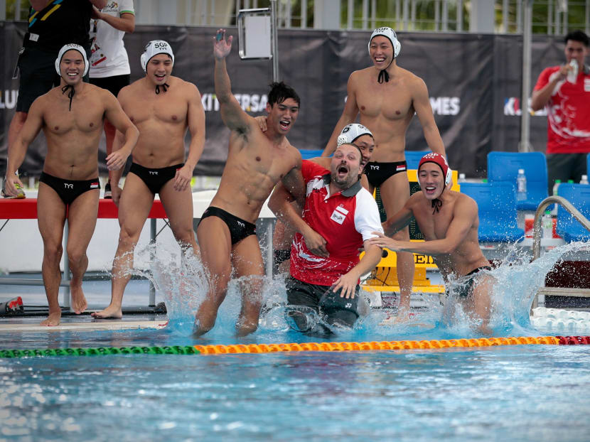 The Singapore waterpolo team celebrating after their 17-4 win over Malaysia that clinched their 27th SEA Games gold. Photo: Jason Quah / TODAY