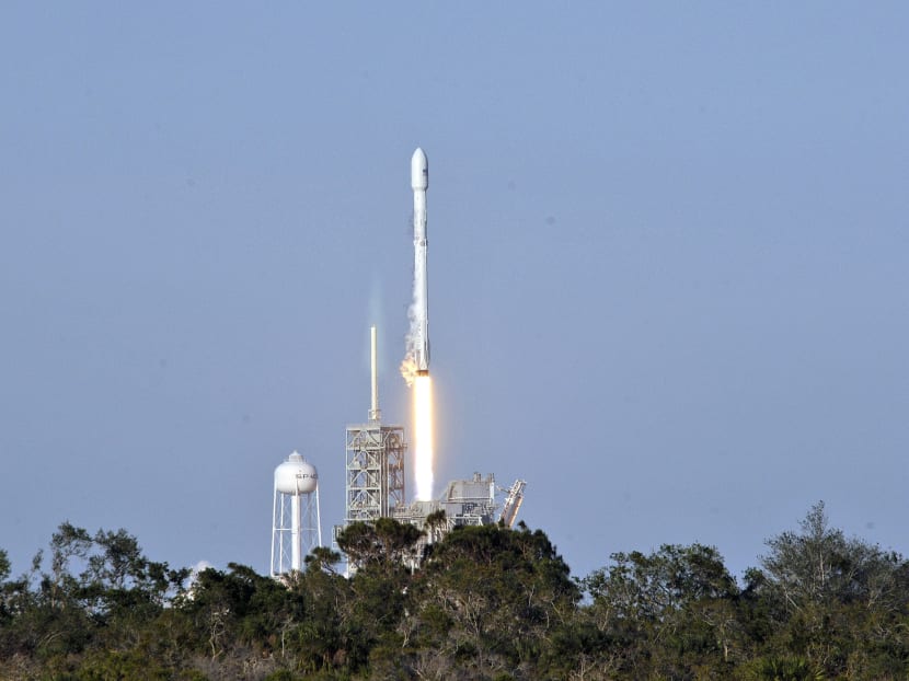 SpaceX's Falcon 9 rocket lifts off from space launch complex 39A at Kennedy Space Centre, Florida on March 30, 2017, with an SES communications satellite. SpaceX blasted off a recycled rocket for the first time on, using a booster that had previously flown cargo to the astronauts living at the International Space Station. Photo: AFP