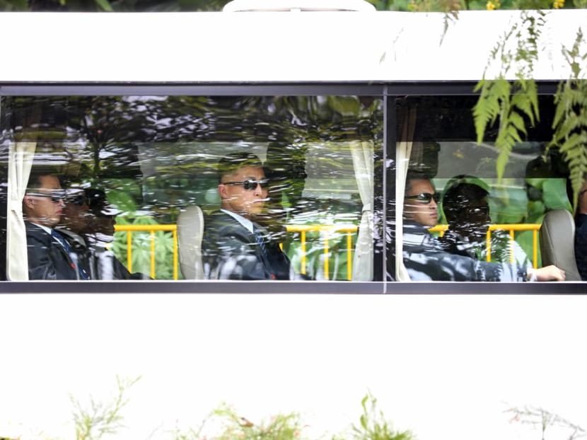 Men in suits, possibly North Korean security officers, arrive in a bus at Capella hotel on Monday (June 11), the day before the US-DPRK Summit will be held.