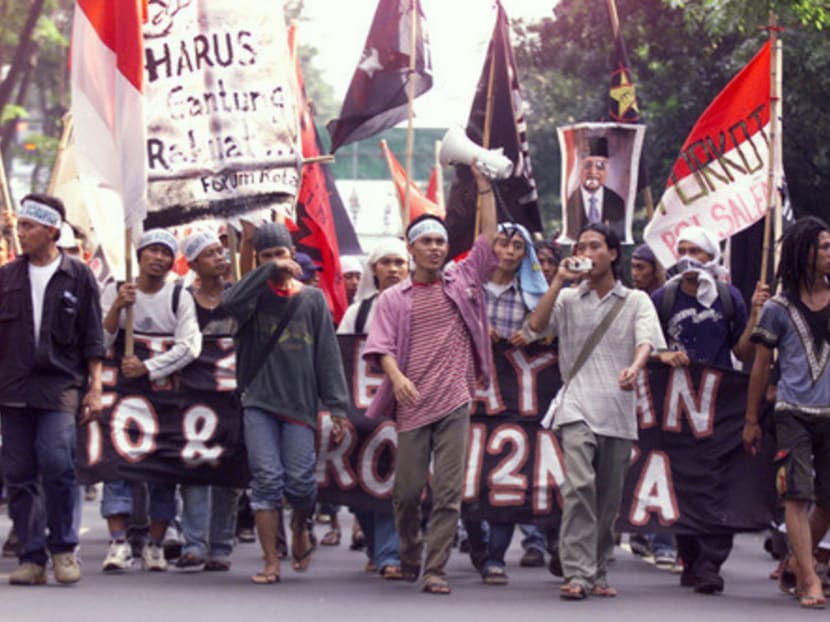 Protesters marching through the streets of Jakarta to mark the anniversary of bloody riots which led to the downfall of President Suharto in 1998. The riots also targeted the dominance of ethnic Chinese in Indonesia. Photo: Reuters