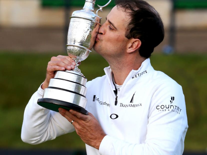 Zach Johnson drinks from the Claret Jug after British Open play