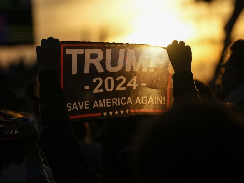 Supporters of former US President Donald Trump await his arrival at a rally for Ohio Republicans at the Dayton International Airport on Nov 7, 2022 in Vandalia, Ohio. 