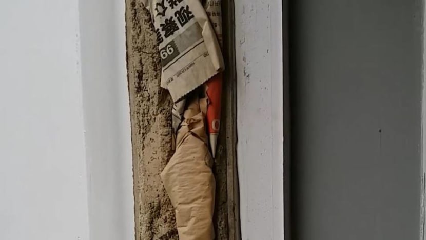 HDB investigating after newspaper found stuffed within walls of flat