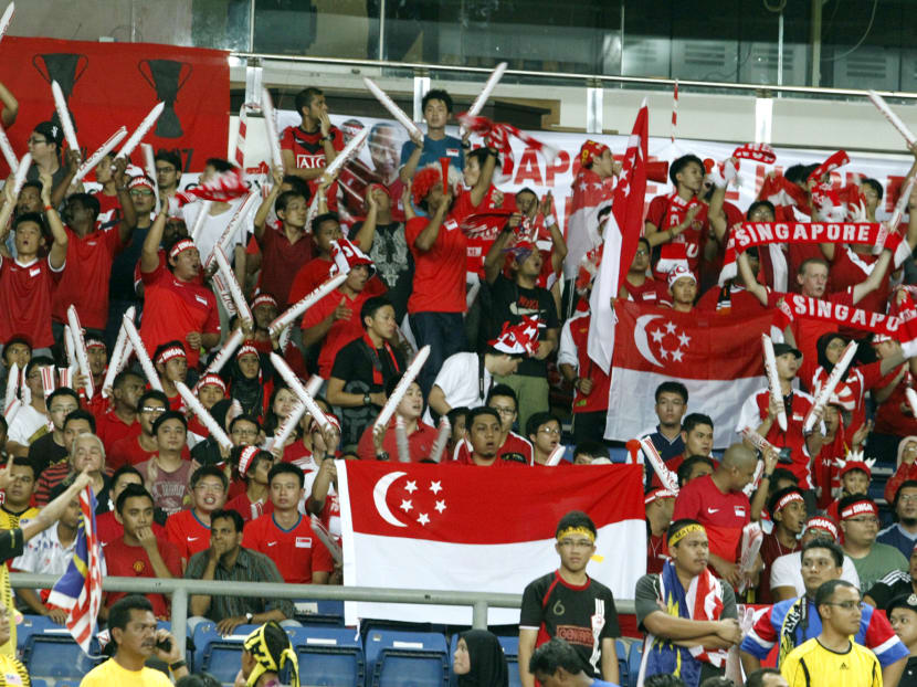 Singaporean fans during a Malaysia vs Singapore match at the 2014 FIFA World Cup Asian Qualifiers held at Bukit Jalil National Stadium in Kuala Lumpur. Photo: Ernest Chua