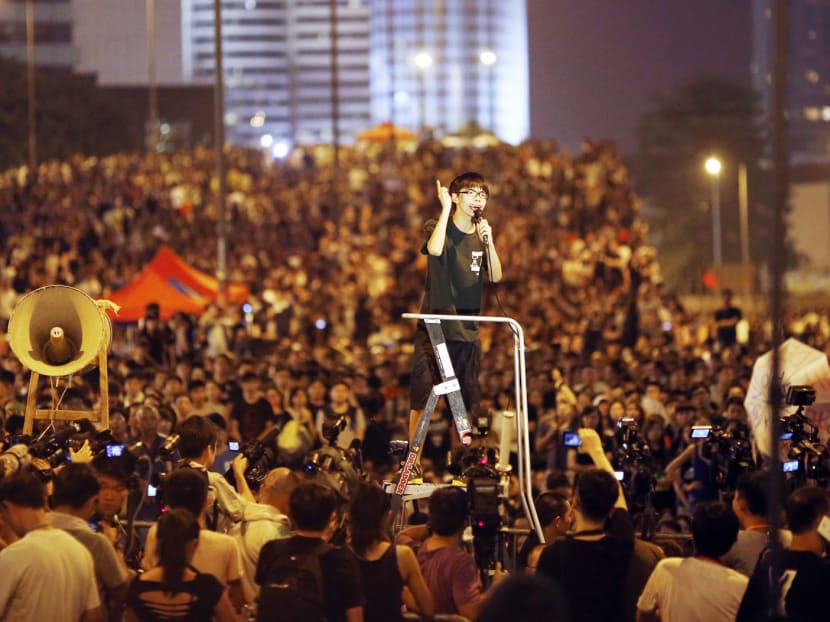 Mr Joshua Wong, leader of the student movement, delivering a speech outside the government headquarters building in Hong Kong in 2014. Support for self-determination and even independence from China has grown rapidly since 2014’s mass occupation of central Hong Kong — also known as the Umbrella Revolution. 

Photo: Reuters